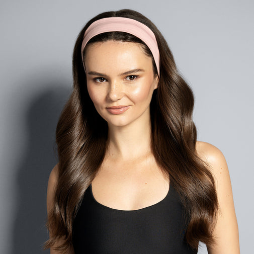 A model wearing The Hair Edit's pink Harmony Headband