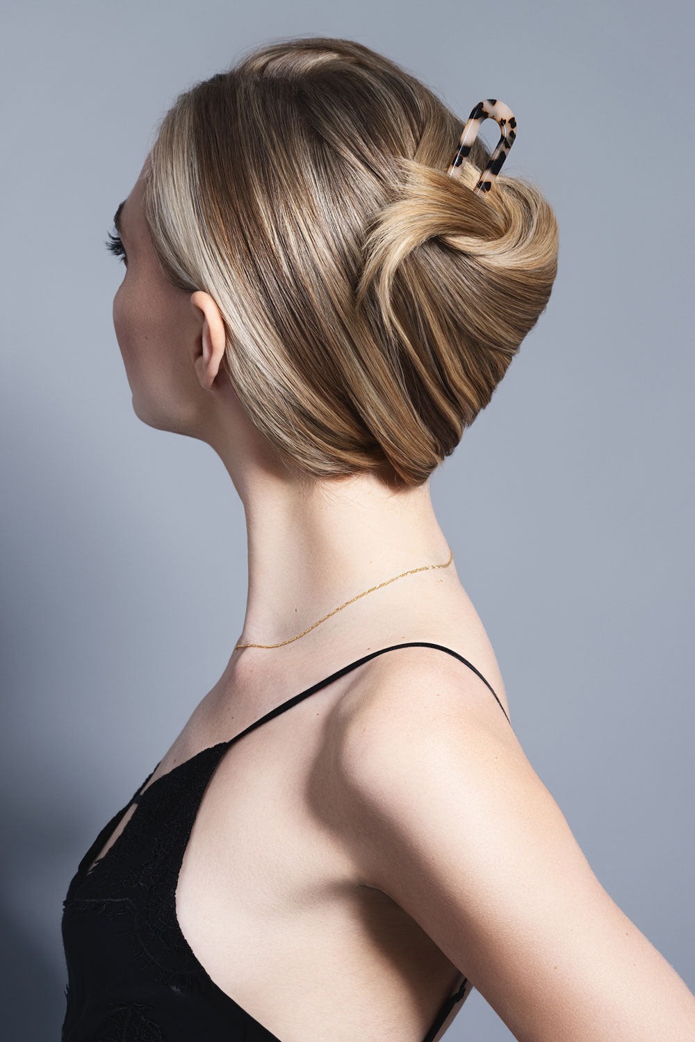 model with tortoise chignon u shaped pin in hair bun