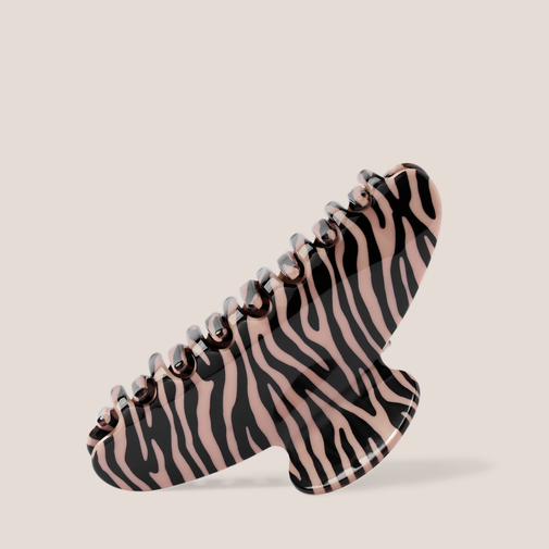 The Hair Edit Untamed Claw Clip on a beige background