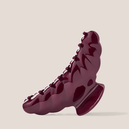The Hair Edit Bordeaux Claw Clip on a beige background