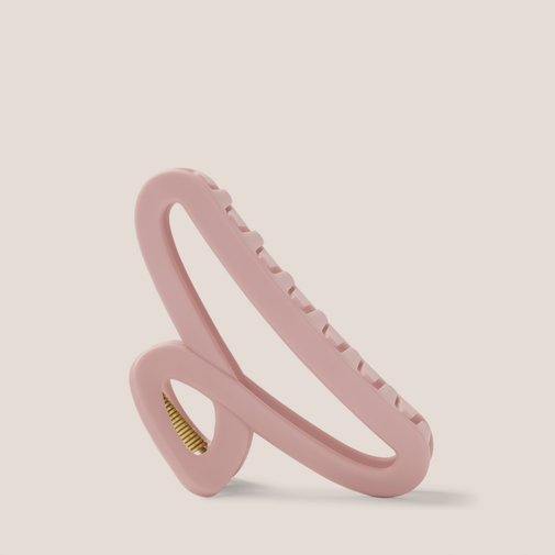 The Hair Edit Flexi Soft Claw Clip on a beige background