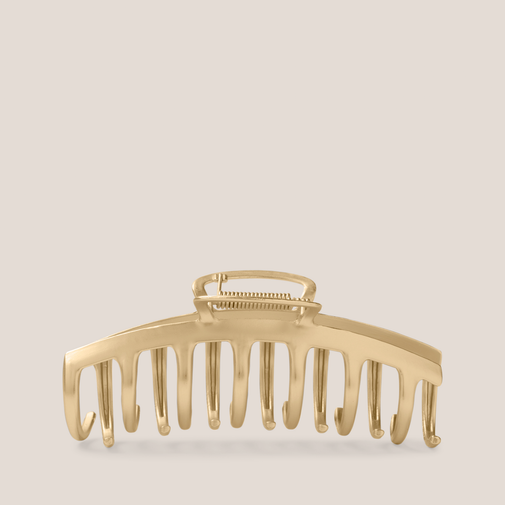The Hair Edit Gilded Timeless Claw Clip on a beige background