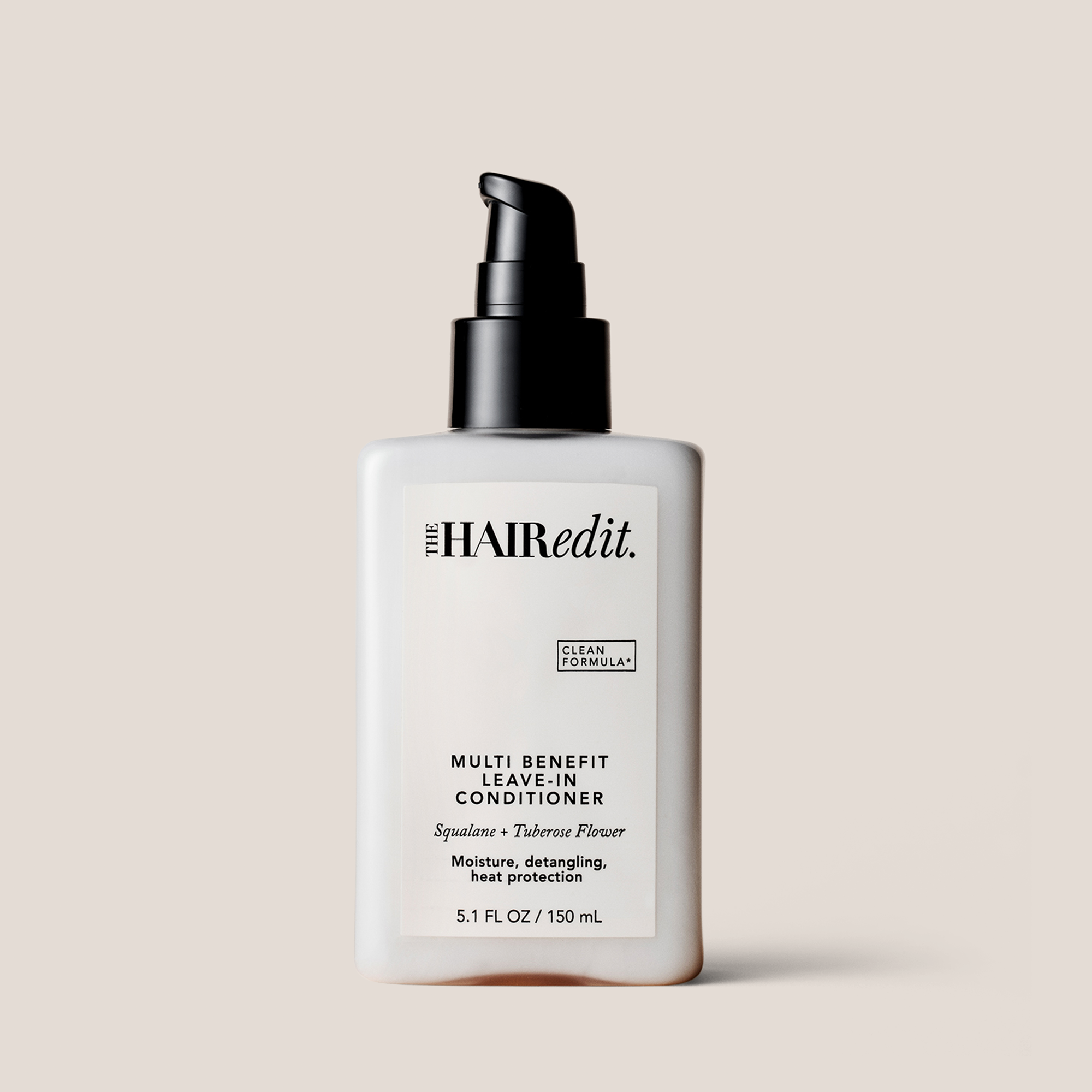 The Hair Edit Multi Benefit Leave-In Conditioner in a 5.1 fl oz white bottle with a black pump dispenser, set against a solid beige background.
