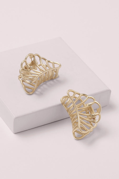 Petite Gilded Mermaid Claw Clips on a pink box 