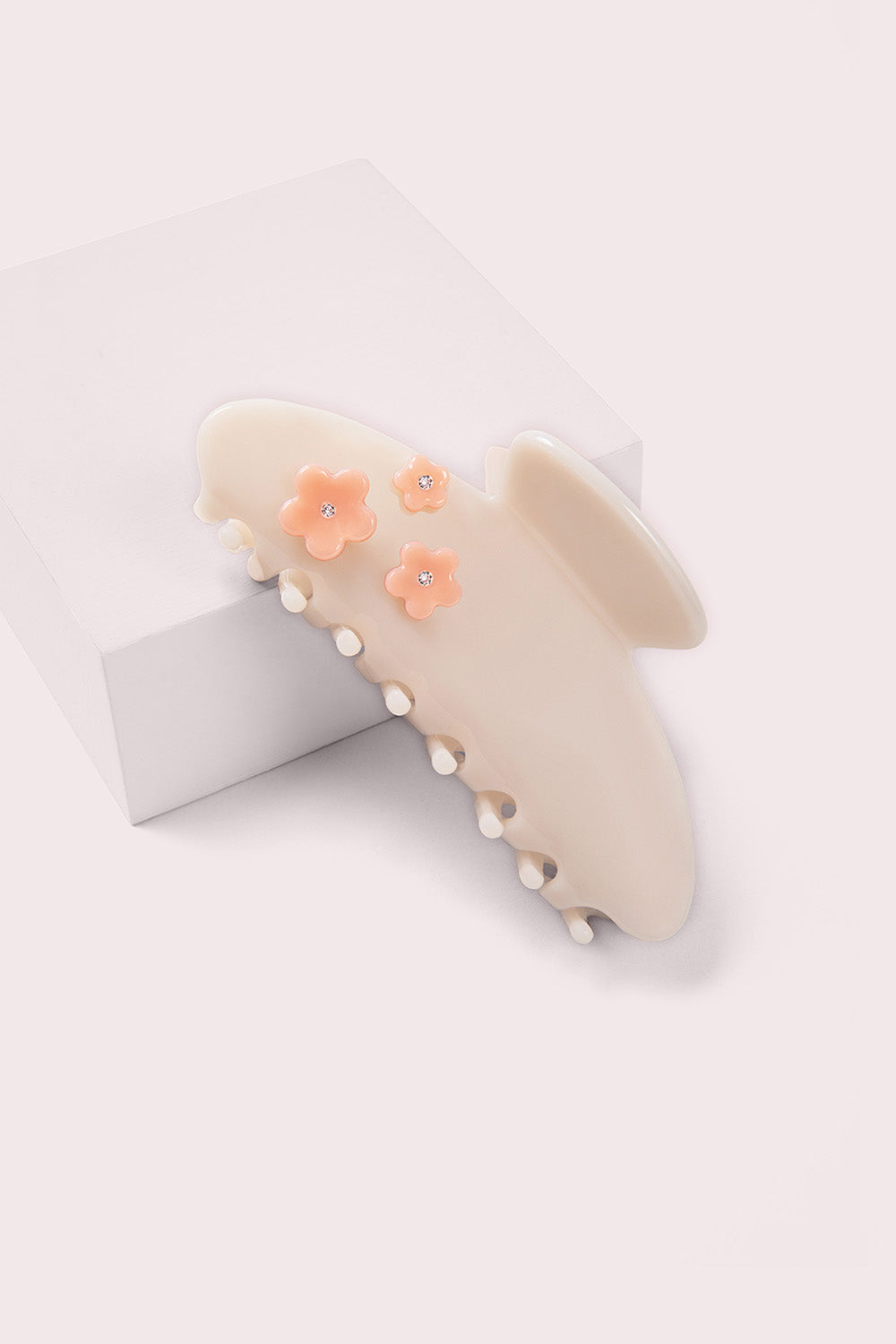the hair edit petal flower claw clip on pink box