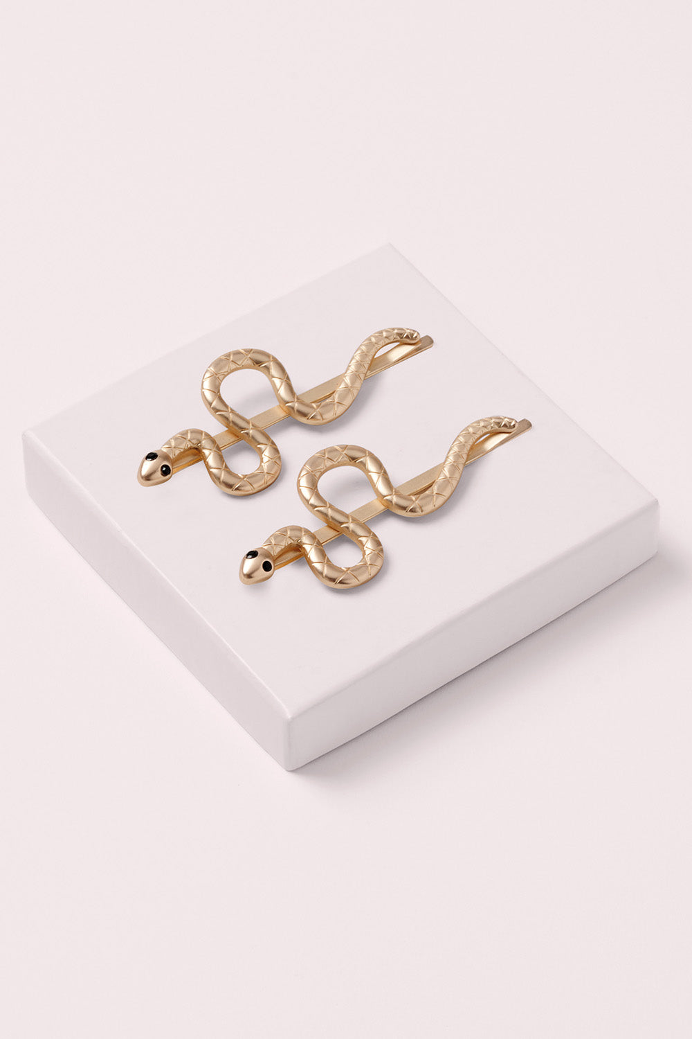 temptation snake bobby pins on white box