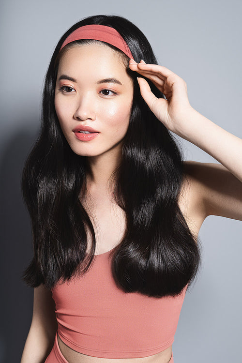 model with Harmony Band Ribbed Headband in her hair 