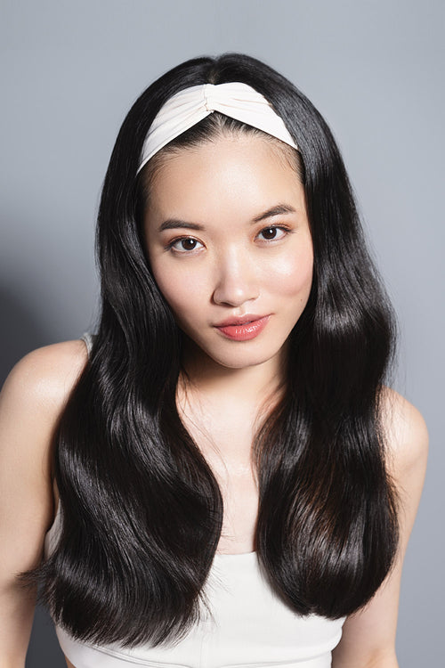 model wearing Lotus Soft Pleated Headband on her head 