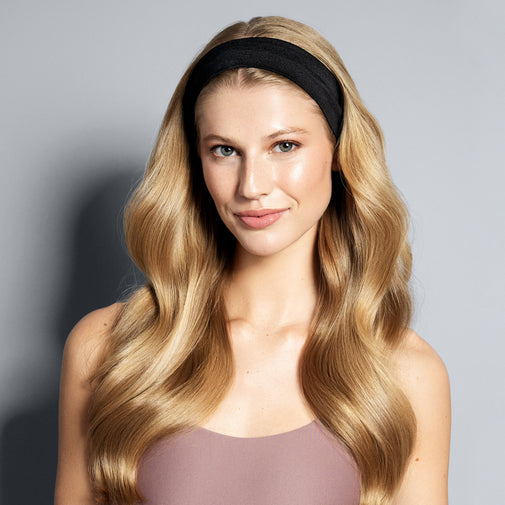 A model wearing The Hair Edit's black Harmony Headband