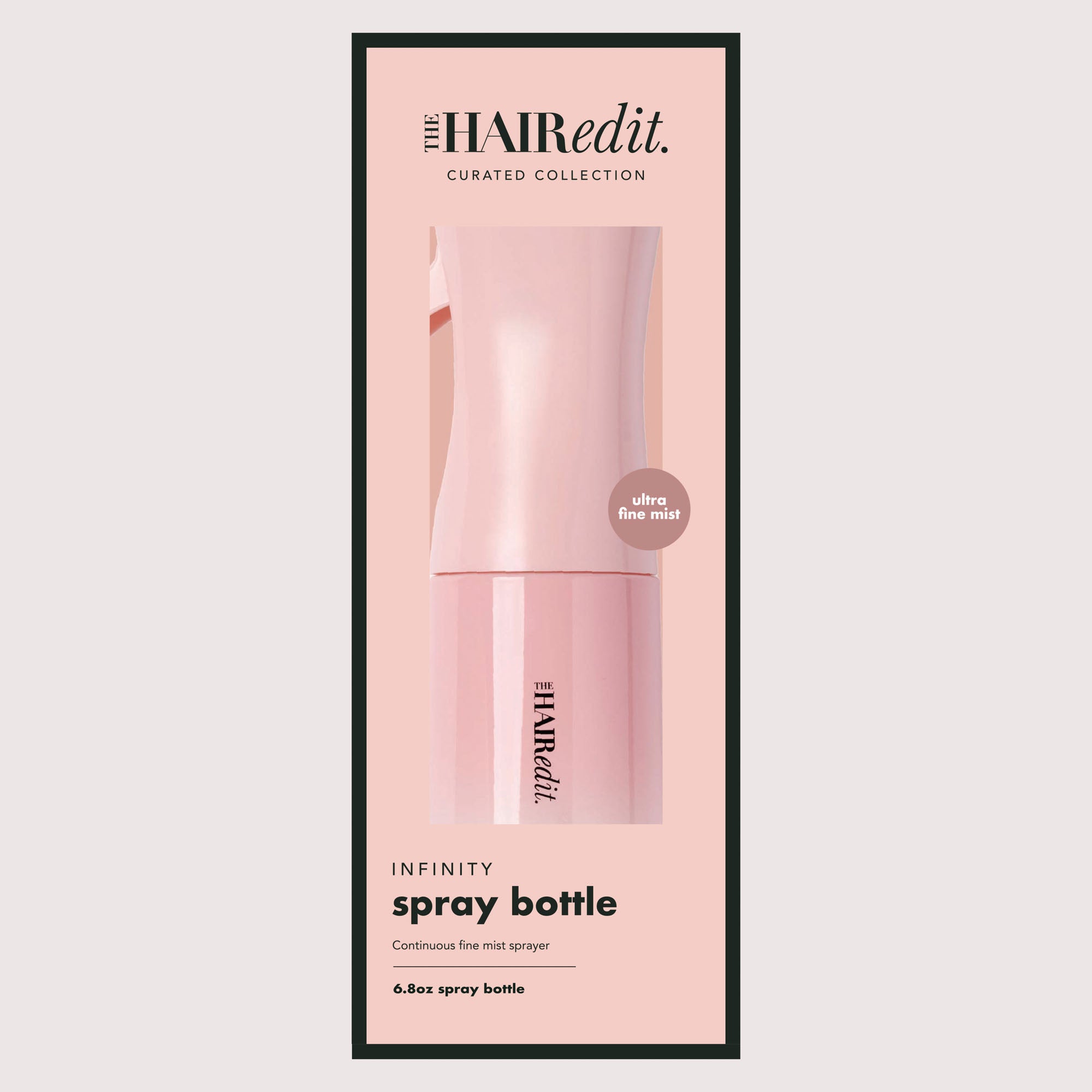 The Hairedit Infinity Spray Bottle in a light pink packaging sleeve, featuring a minimalist design with black text and a thin black border on a light gray background.7
