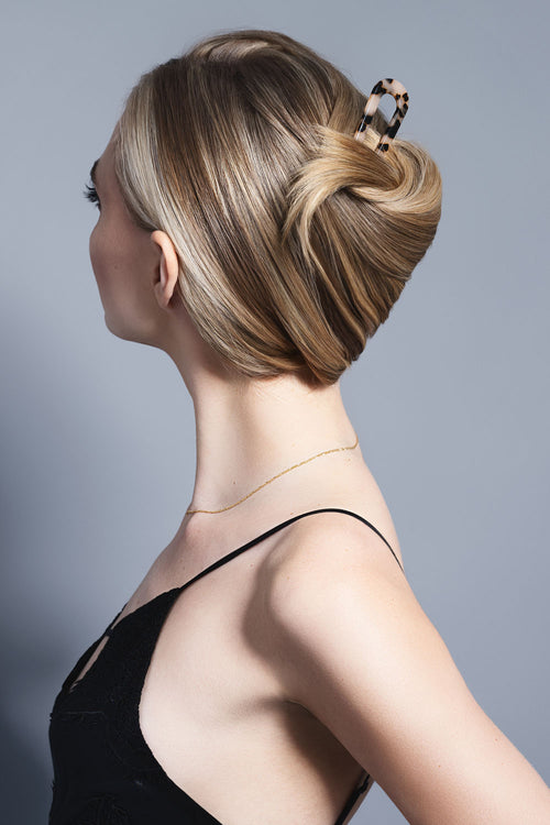 model with tortoise chignon u shaped pin in hair bun