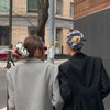 Video of Danielle Bernstein wearing  The Hair Edit's Oversized Polka Dot Ruffle Scrunchie and walking with model in streets of New York City