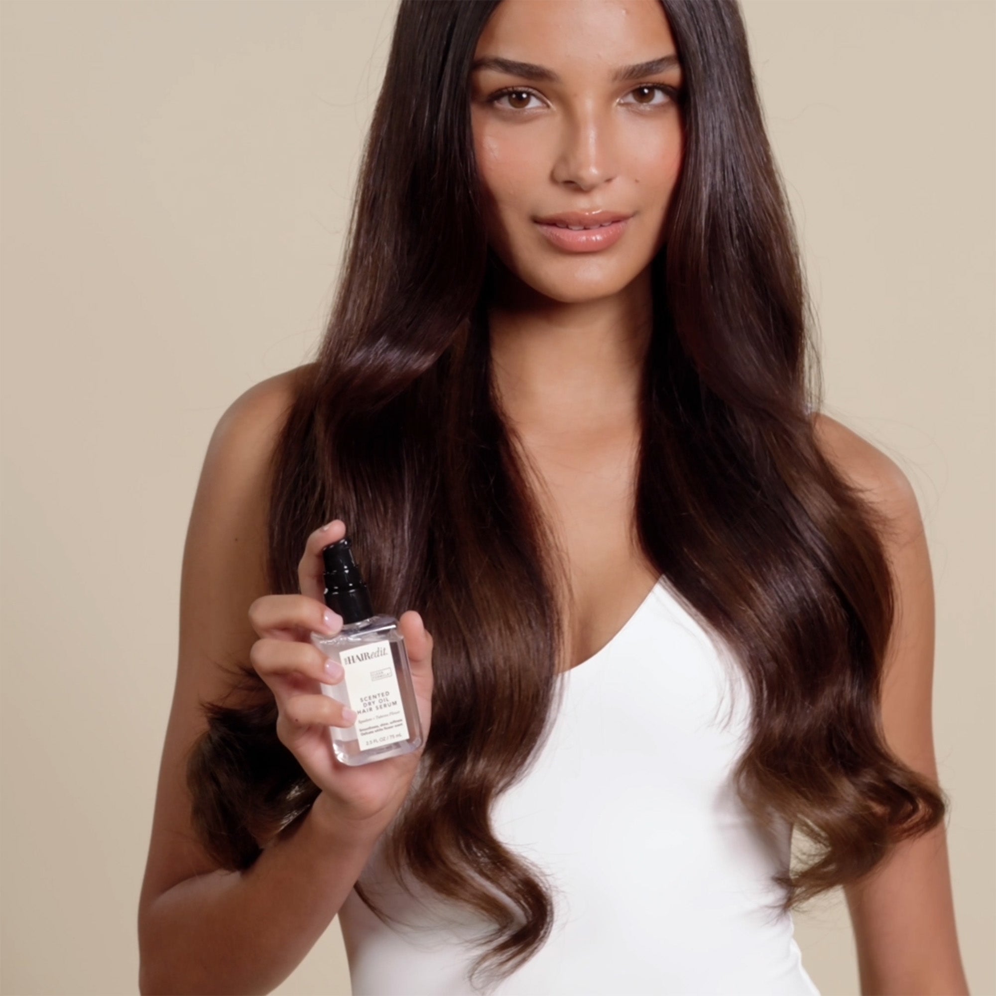 A video of a model demonstrating how to use Scented Dry Oil Hair Serum12