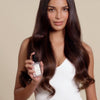 A video of a model demonstrating how to use Scented Dry Oil Hair Serum