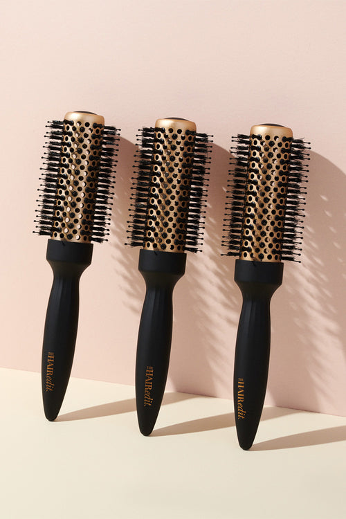 The Hair Edit round ceramic vented barrel blowdry & shine black & gold brush display