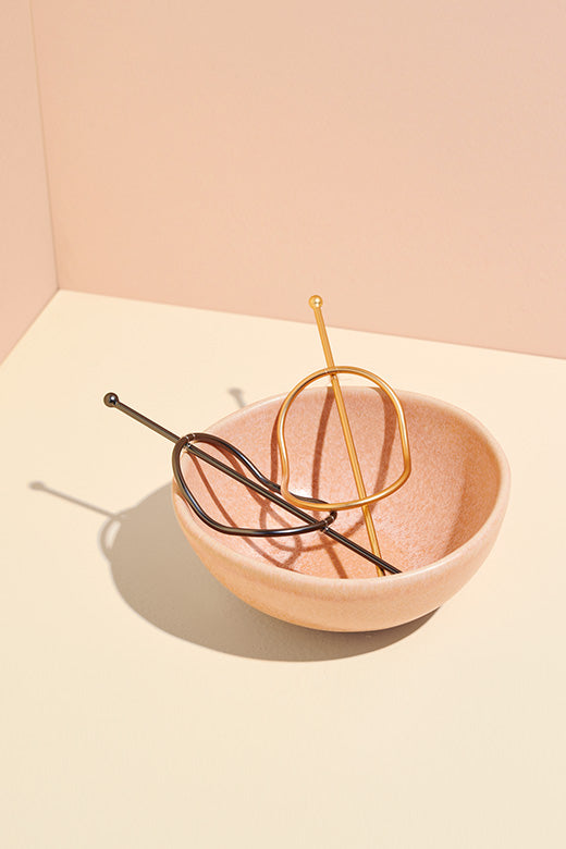 The Hair Edit gold & black hair slide updo holders displayed in pink bowl