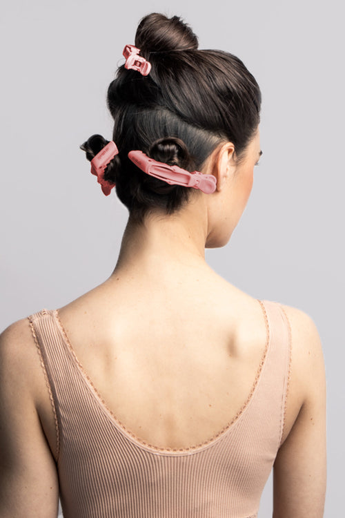 the hair edit pink gator clips in models hair 