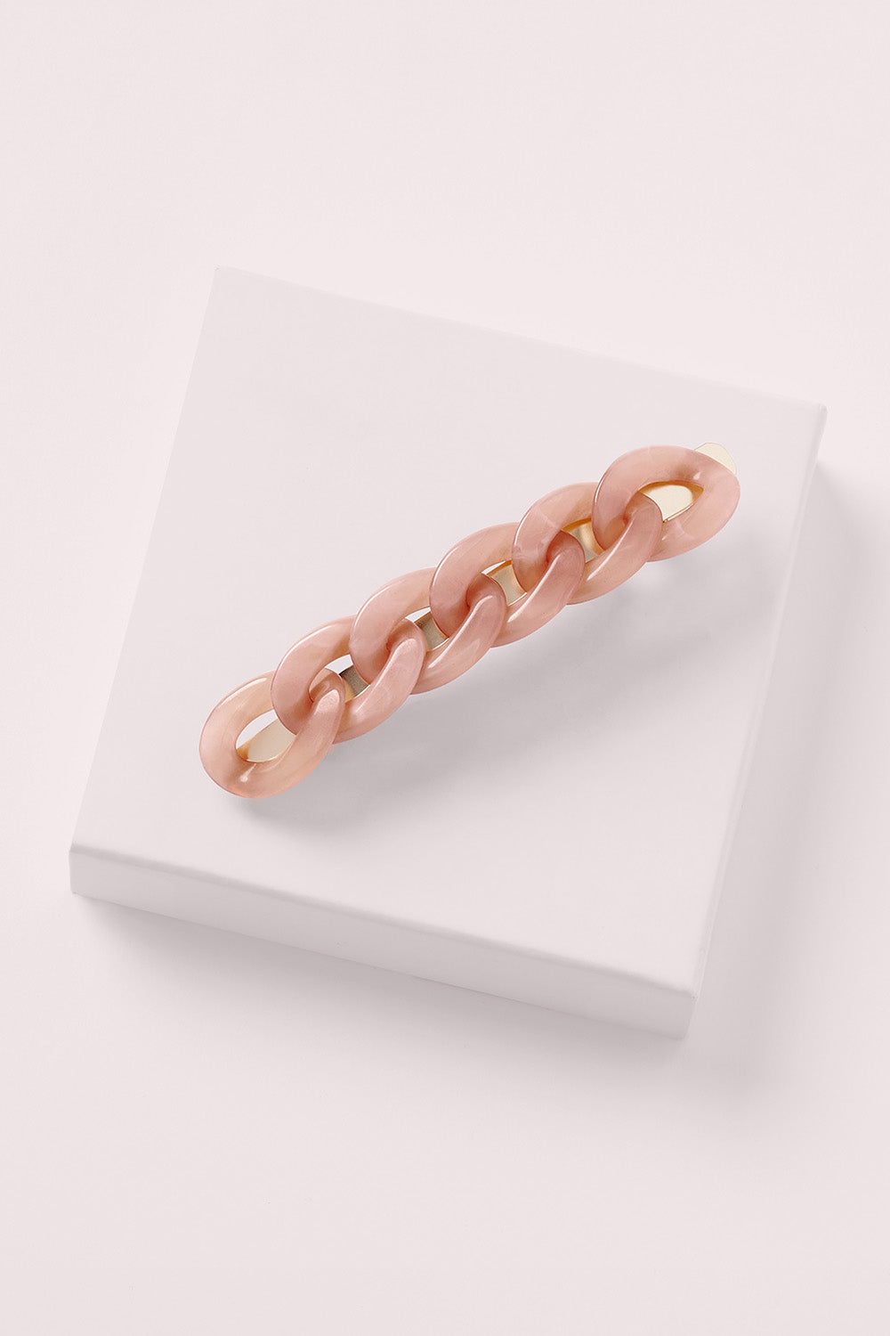 cable baguette barrette in champagne marble on white box