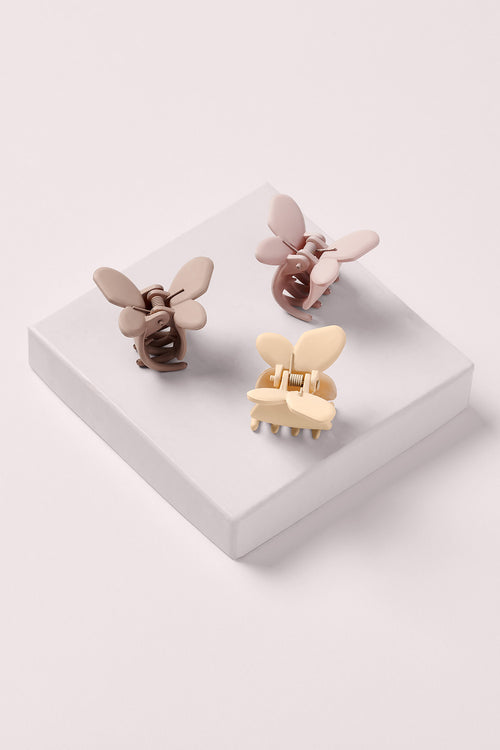 mini butter fly clips on white box